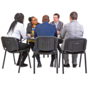 People sitting around a table in an interview.